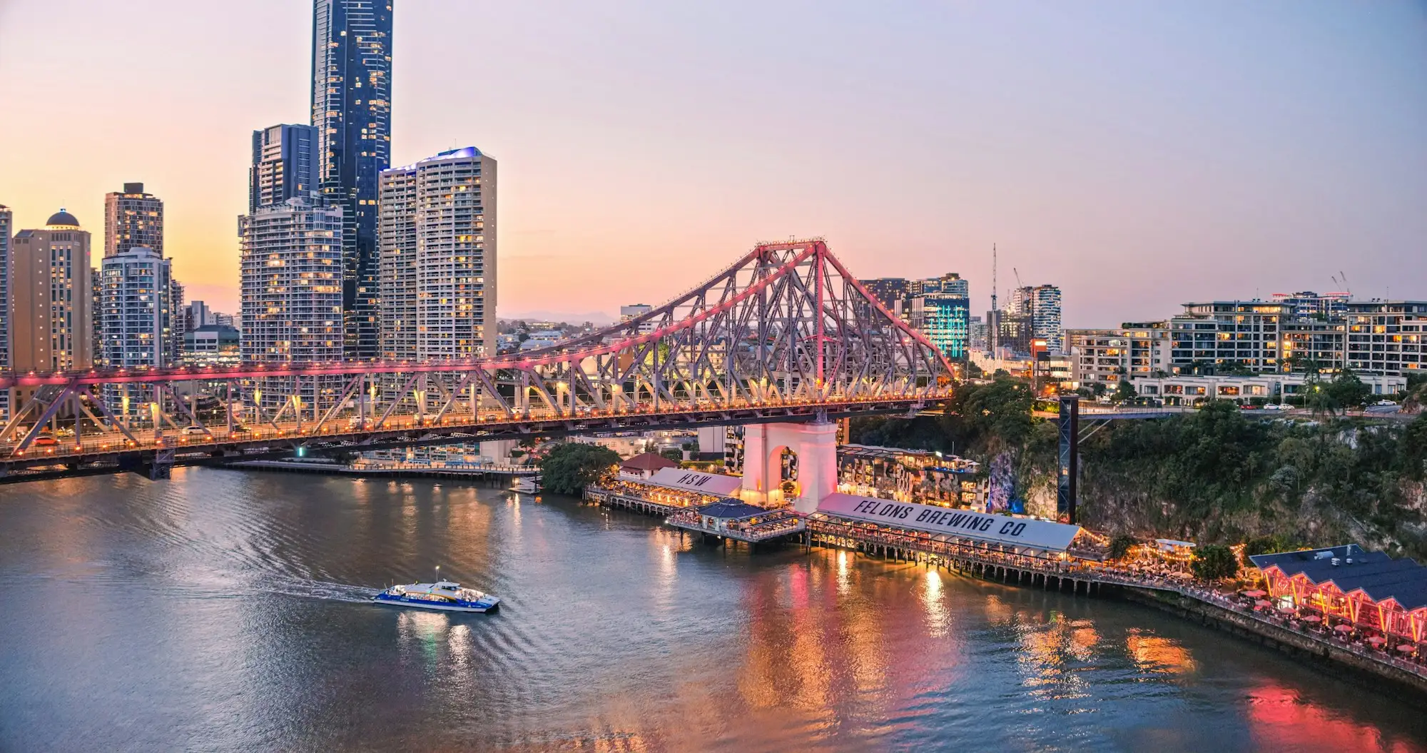 The Story Bridge and the Brisbane city skyline at dusk
